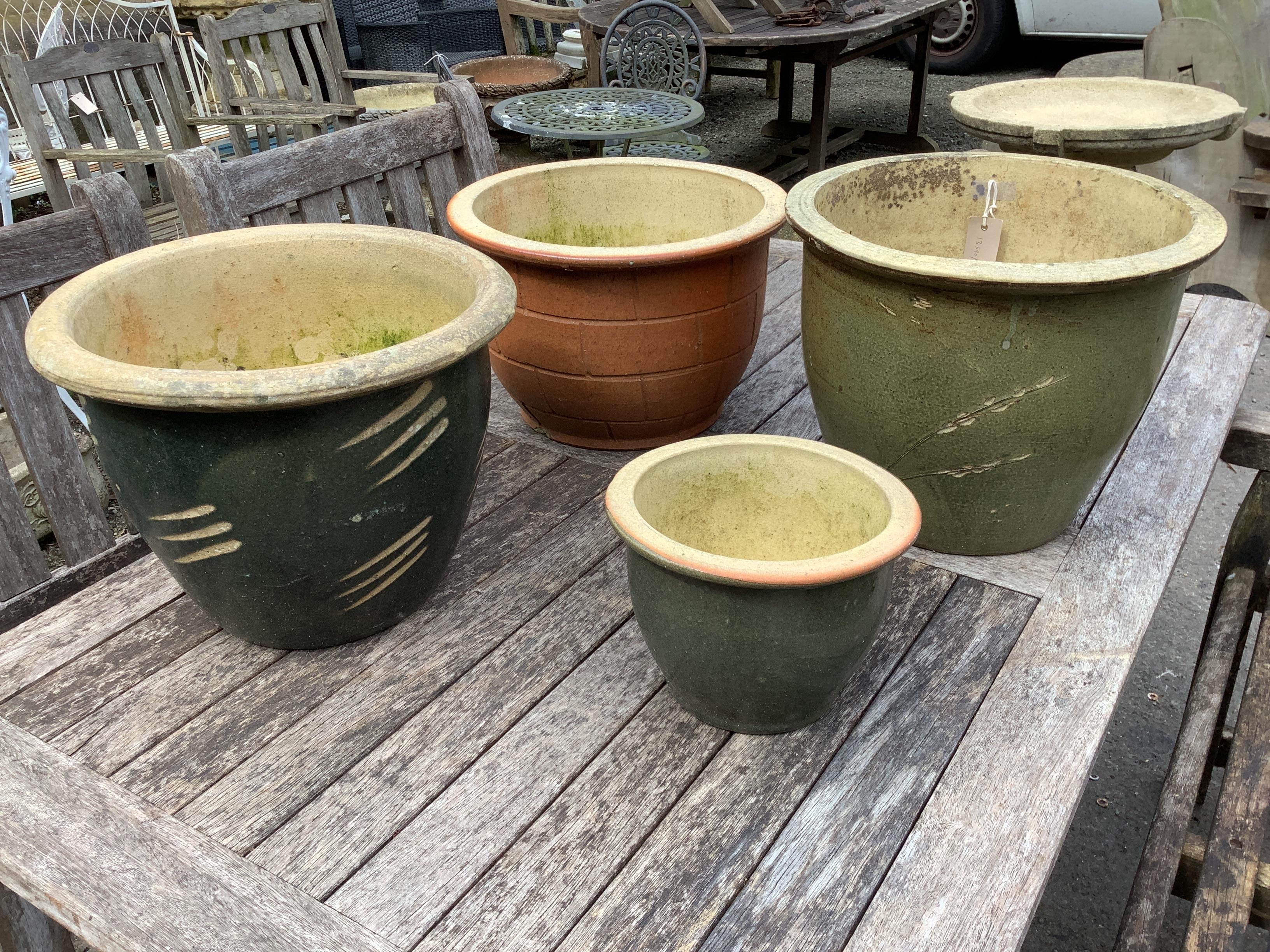 Four circular glazed earthenware garden planters, largest diameter 38cm, height 31cm